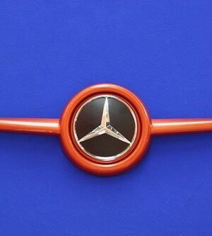 This is the Front Grille, available for the new Smart Fortwo 453 in Lava Orange Metallic color with the original Mercedes-Benz Emblem.
