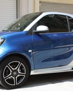 This is the side view of a Smart Fortwo 453 with installed the Fender Flares (in Midnight Blue with Silver Tridion color) , the Side Skirts and the Air Scoop.